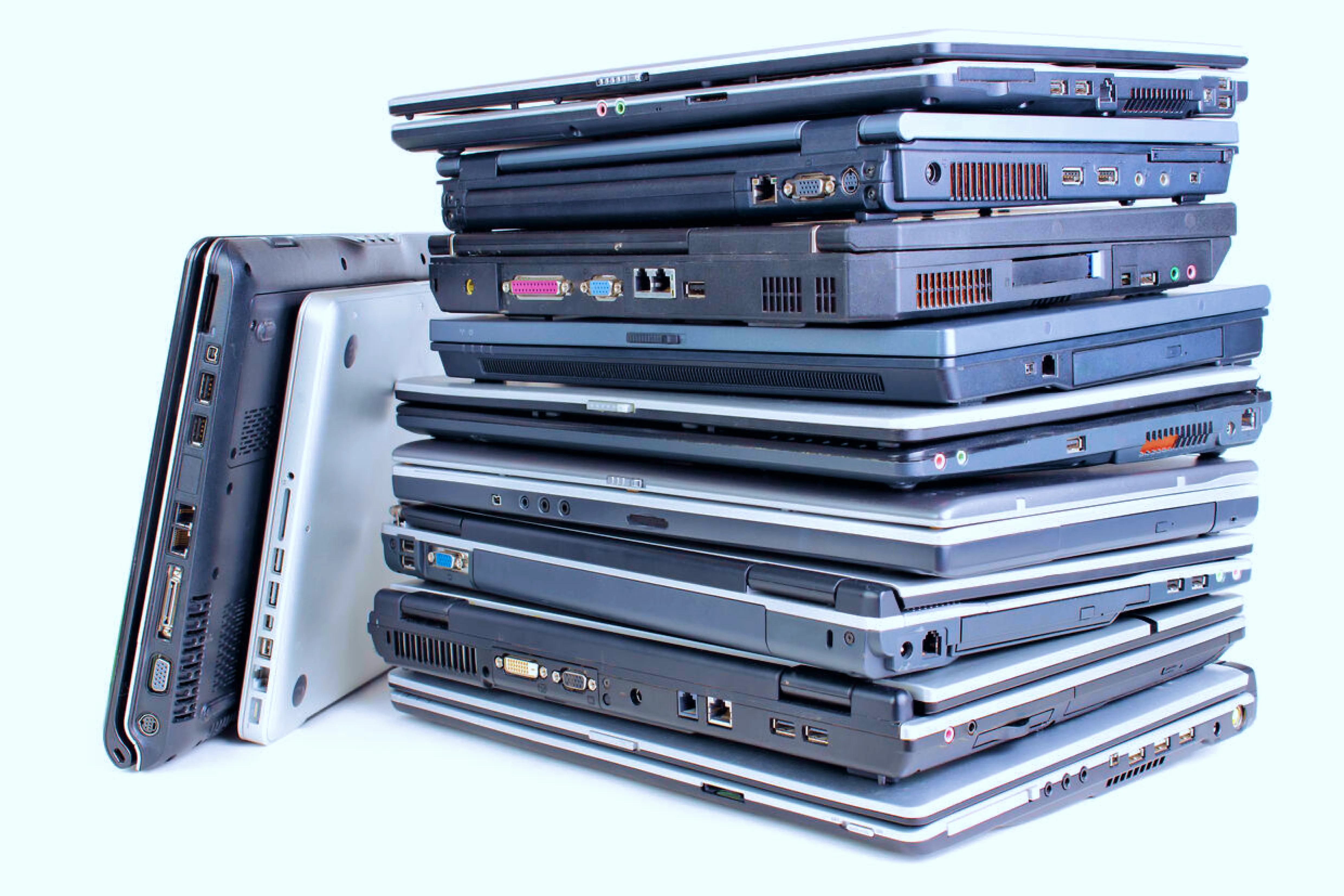 Pile of no-longer used laptops.